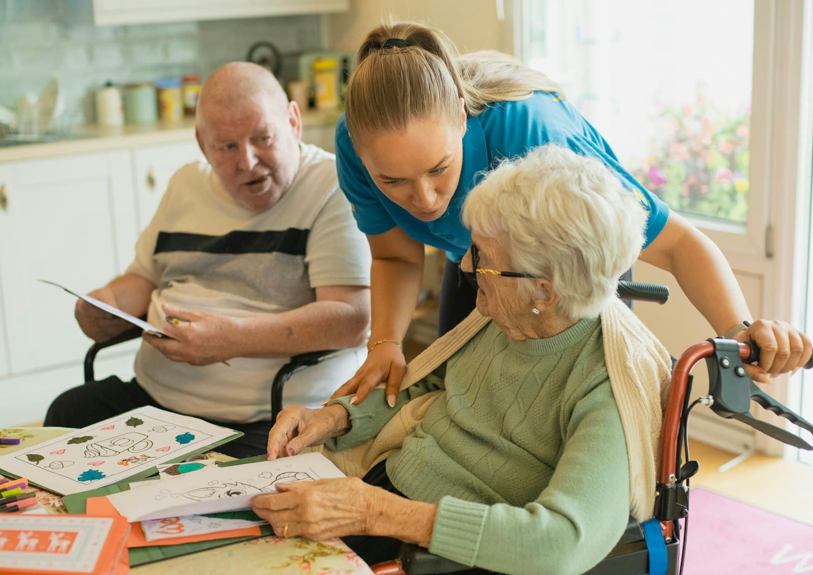 A companion caregiver sitting with an older adult