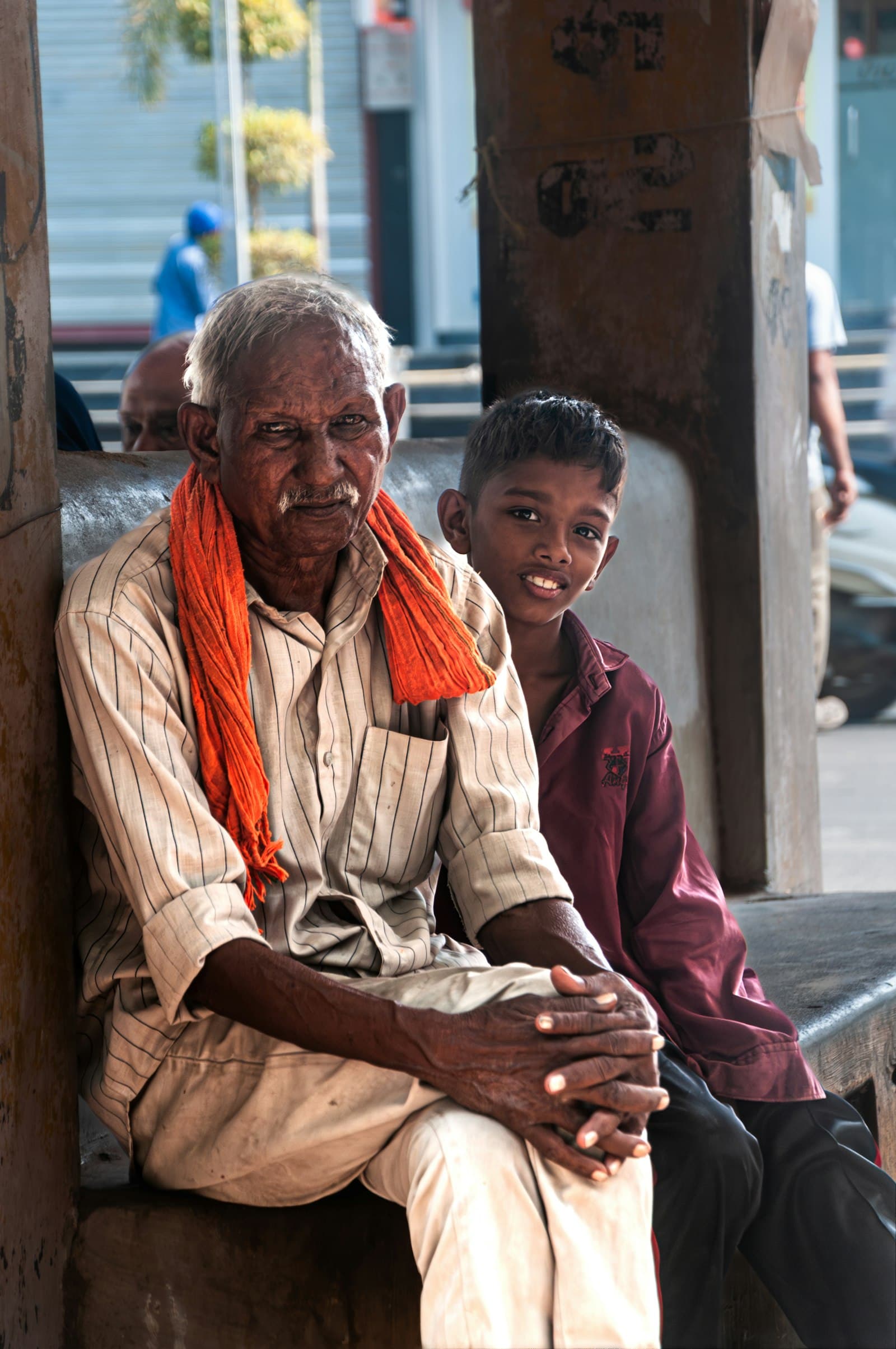 A grandfather holding a young child